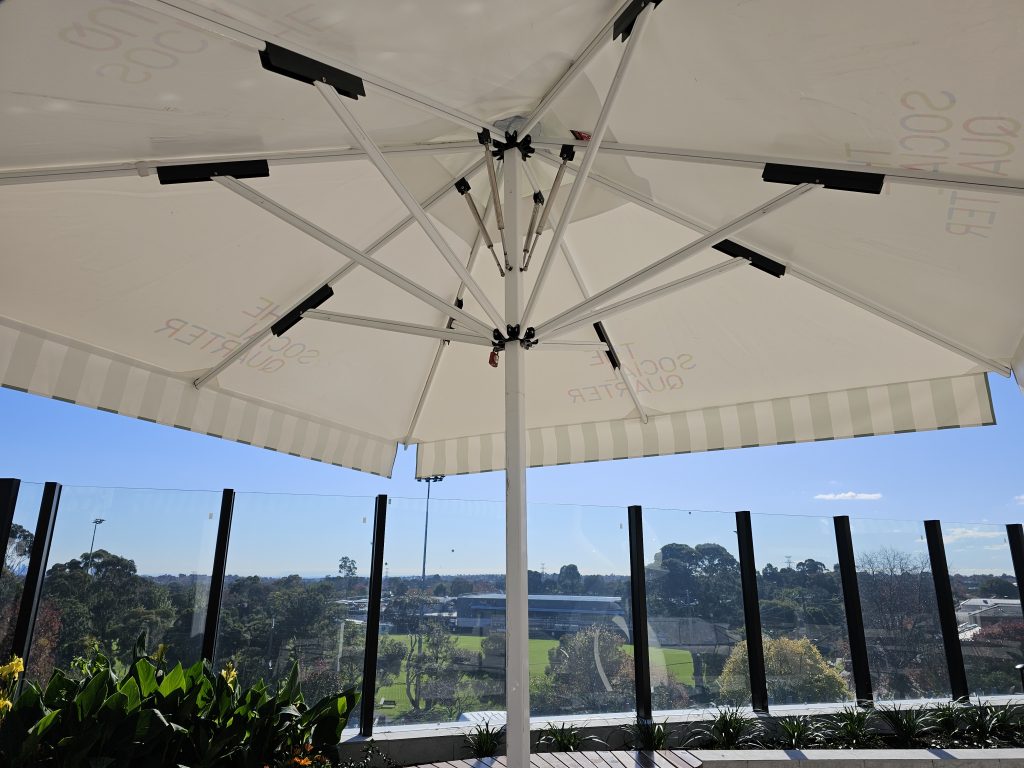 Under shot of square pole umbrella with gas struts at The Social Quarter